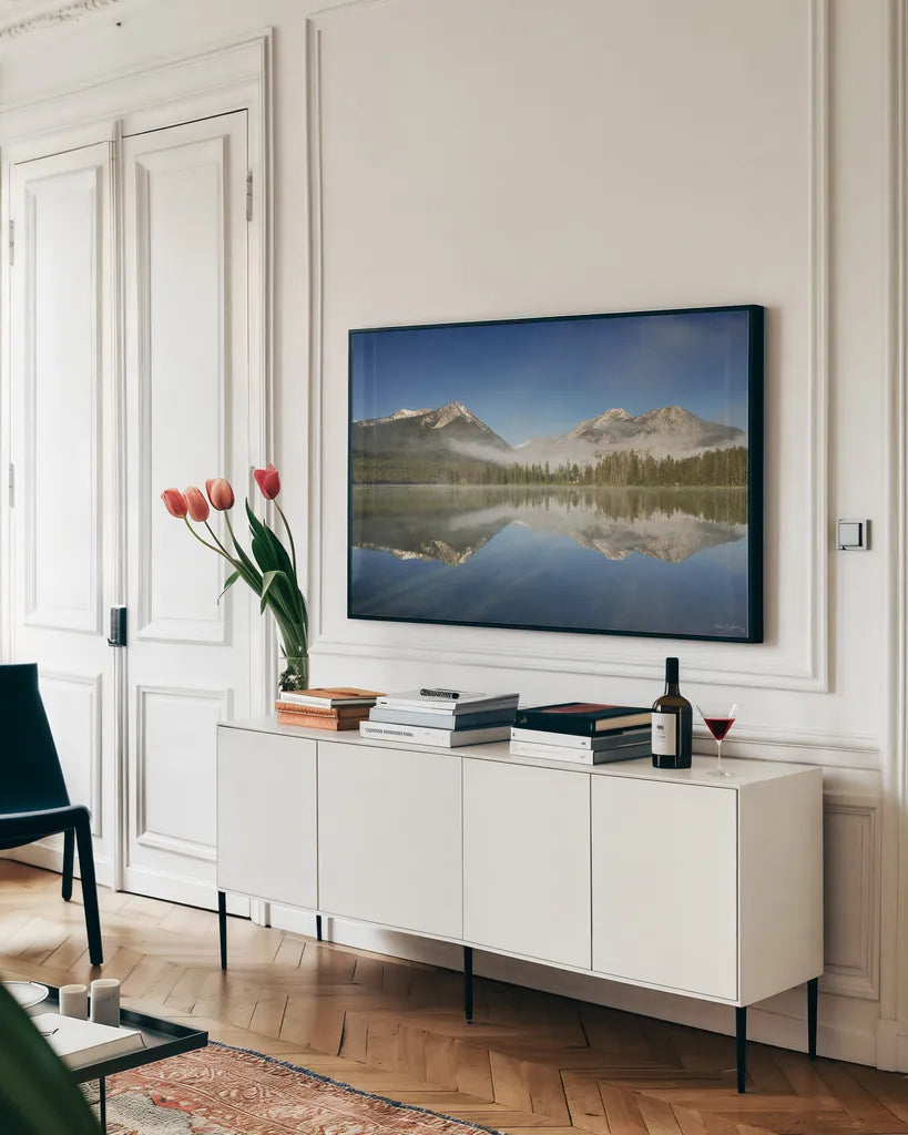 Petit Lake Reflection by Alan Majchrowicz. shown as a framed stretched canvas in a living room above a console. Available as a archival giclee rolled canvas, fine art paper, or poster print. SKU 28095i.