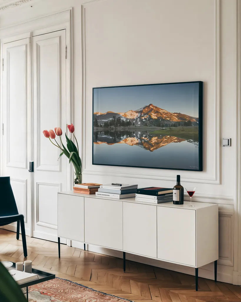 South Sister Reflection II by Alan Majchrowicz. shown as a framed stretched canvas in a living room above a console. Available as a archival giclee rolled canvas, fine art paper, or poster print. SKU 28097i.