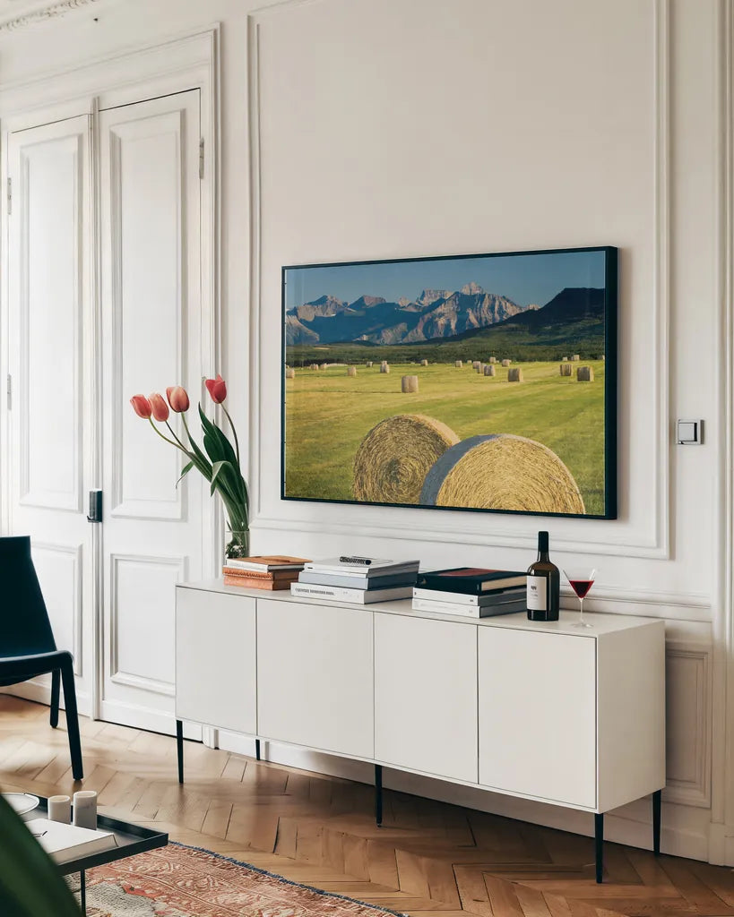 Waterton Hay Bales by Alan Majchrowicz. shown as a framed stretched canvas in a living room above a console. Available as a archival giclee rolled canvas, fine art paper, or poster print. SKU 53741i.