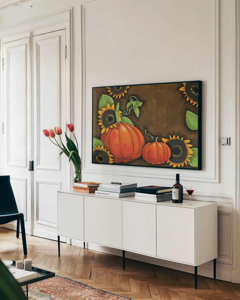 Pumpkins and Sunflowers by Anne Tavoletti. shown as a framed stretched canvas in a living room above a console. Available as a archival giclee rolled canvas, fine art paper, or poster print. SKU 26711i.