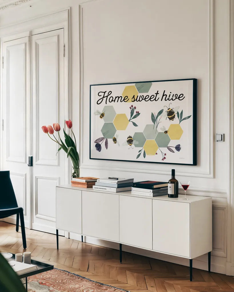 Bees Home Sweet Hive by Becky Thorns. shown as a framed stretched canvas in a living room above a console. Available as a archival giclee rolled canvas, fine art paper, or poster print. SKU 71037i.