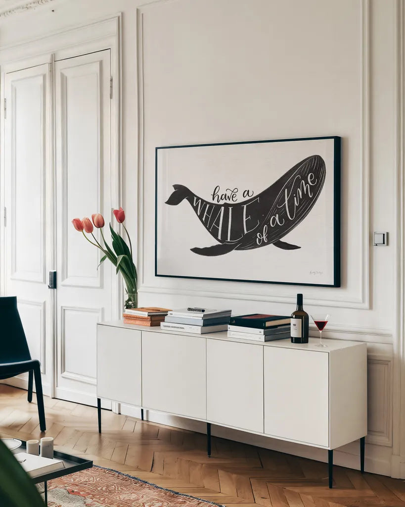 Whale of a Time BW by Becky Thorns. shown as a framed stretched canvas in a living room above a console. Available as a archival giclee rolled canvas, fine art paper, or poster print. SKU 61411i.