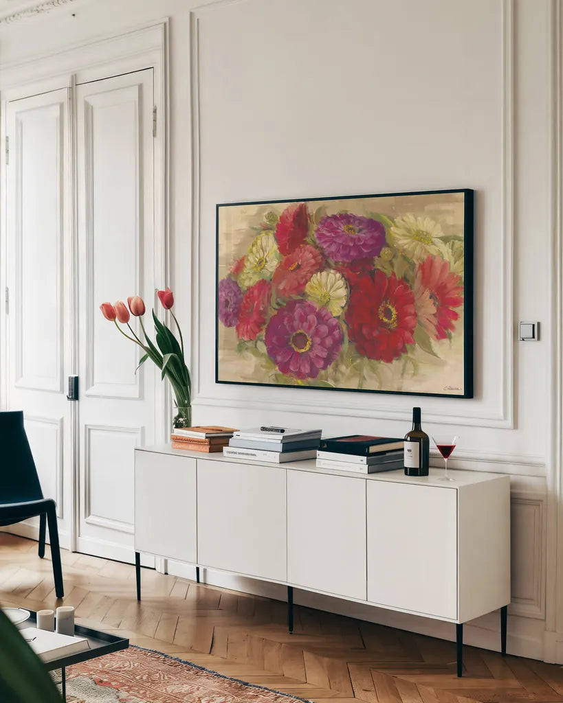 Summer Zinnias II by Carol Rowan. shown as a framed stretched canvas in a living room above a console. Available as a archival giclee rolled canvas, fine art paper, or poster print. SKU 41931i.