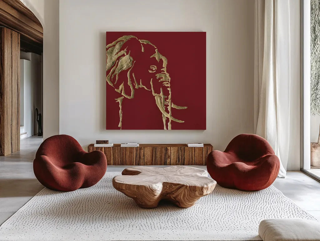 Gilded Elephant on Red by Chris Paschke. Shown as extra-large giant wall art in a modern living room. Available as an archival giclee rolled canvas, fine art paper, or poster print. SKU 41921a.