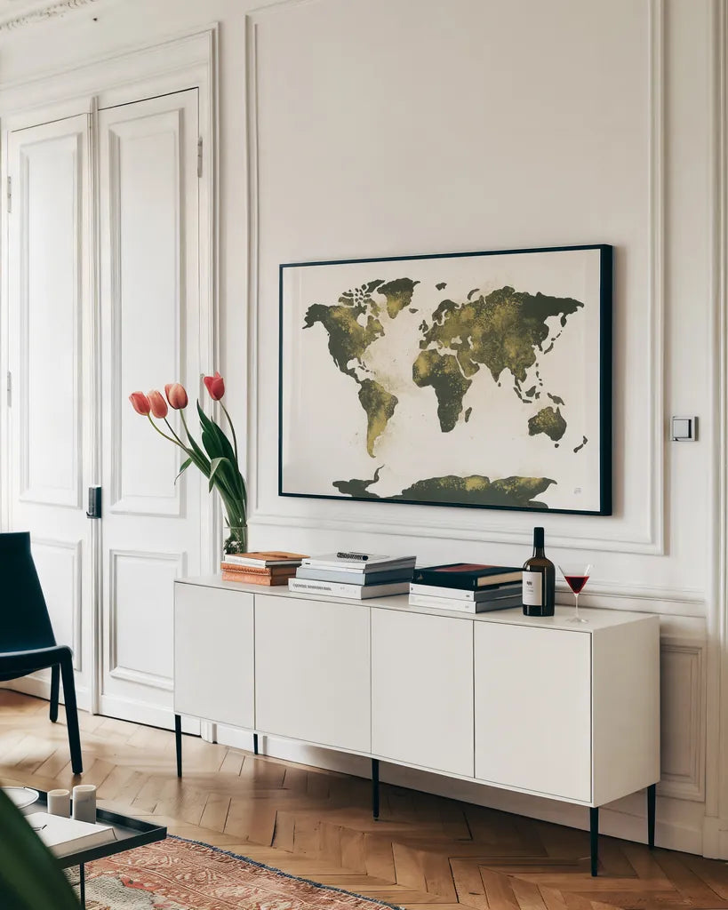 World Map Gold Dust by Chris Paschke. shown as a framed stretched canvas in a living room above a console. Available as a archival giclee rolled canvas, fine art paper, or poster print. SKU 53224i.