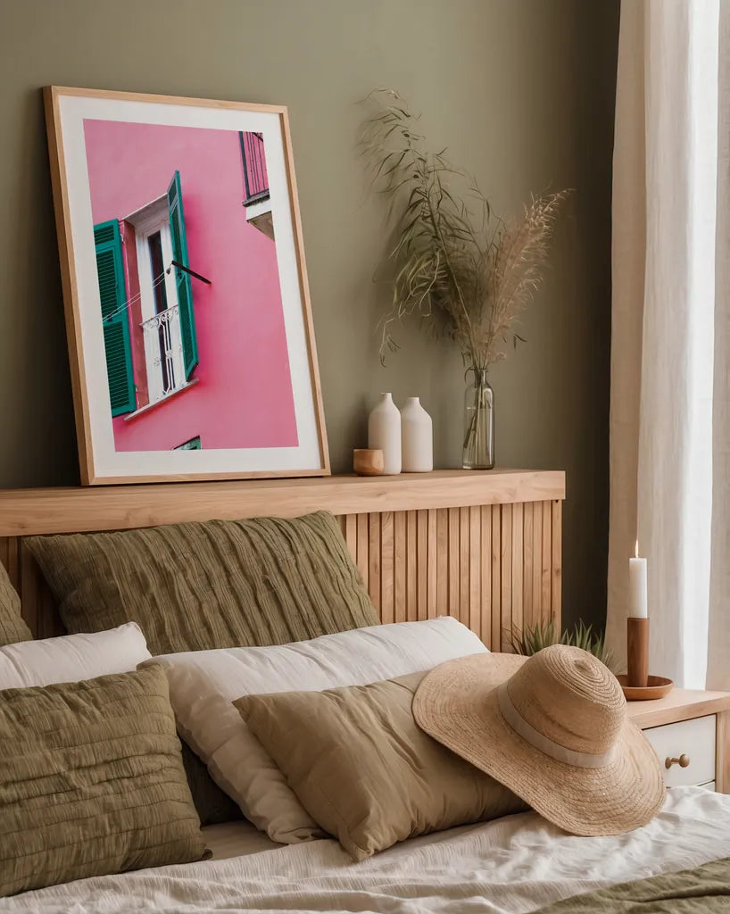 Cinque Terre Pink by Deborah Revell. shown as a paper print in a natural frame. Available as a archival giclee rolled canvas, fine art paper, or poster print. SKU 95016h.