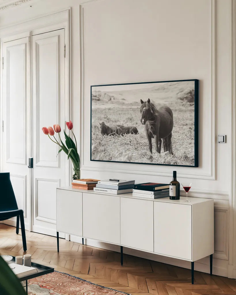Dartmoor Ponies I by Deborah Revell. shown as a framed stretched canvas in a living room above a console. Available as a archival giclee rolled canvas, fine art paper, or poster print. SKU 94277i.