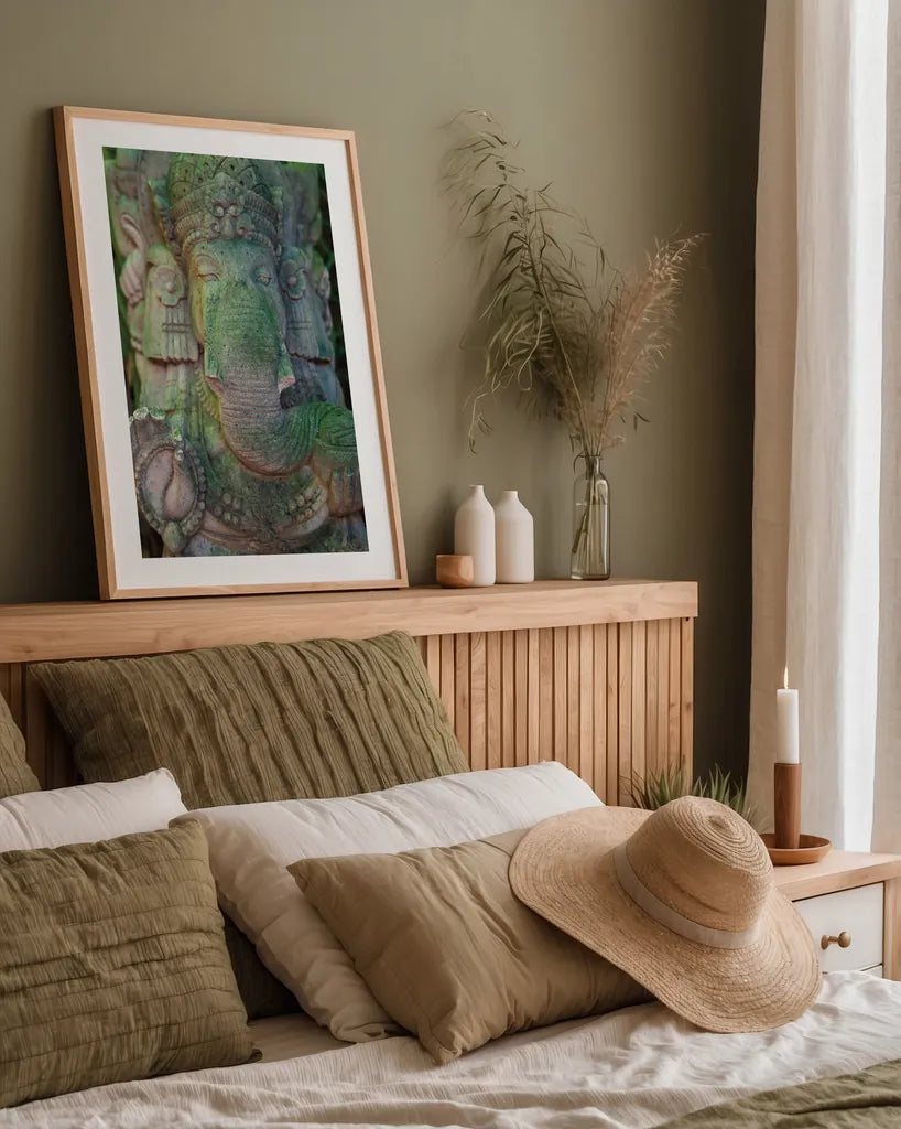 Ganesha Statue by Deborah Revell. shown as a paper print in a natural frame. Available as a archival giclee rolled canvas, fine art paper, or poster print. SKU 94002h.