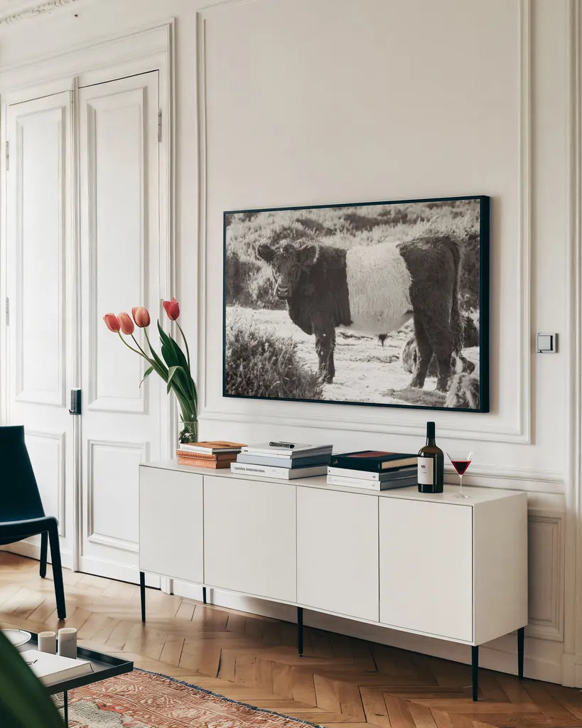 Standing Cow by Deborah Revell. shown as a framed stretched canvas in a living room above a console. Available as a archival giclee rolled canvas, fine art paper, or poster print. SKU 94286i.
