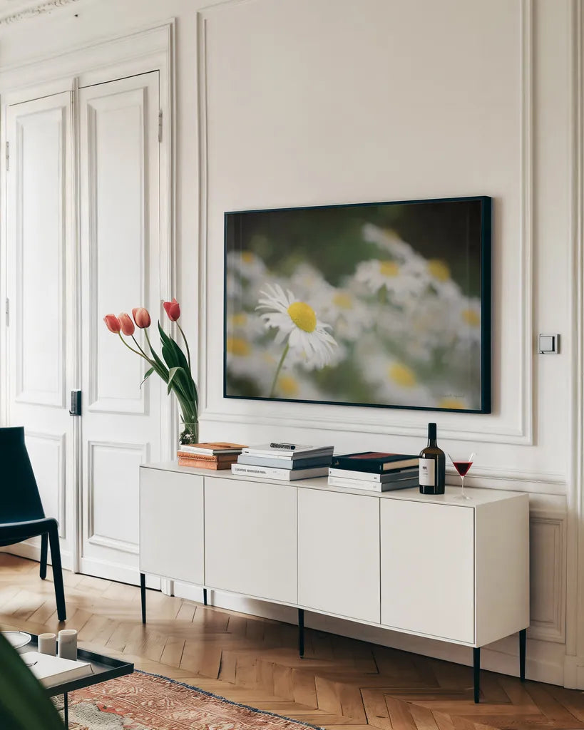 Daisies III by Elizabeth Urquhart. shown as a framed stretched canvas in a living room above a console. Available as a archival giclee rolled canvas, fine art paper, or poster print. SKU 25867i.