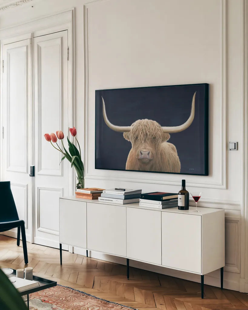 Highland Cow Navy by James Wiens. shown as a framed stretched canvas in a living room above a console. Available as a archival giclee rolled canvas, fine art paper, or poster print. SKU 56160i.