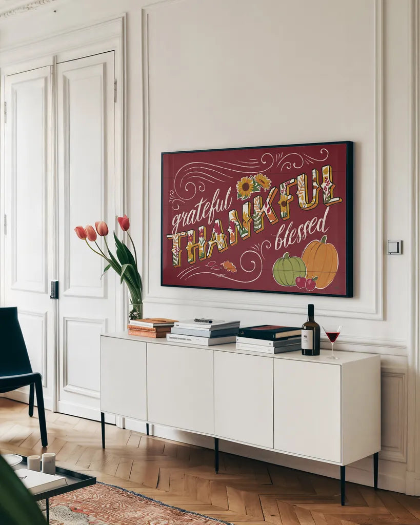Thankful I Red by Janelle Penner. shown as a framed stretched canvas in a living room above a console. Available as a archival giclee rolled canvas, fine art paper, or poster print. SKU 45431i.