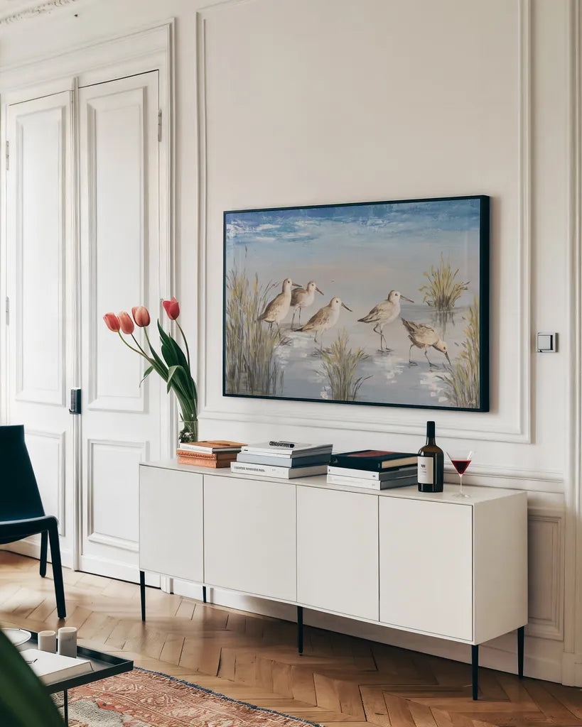 Sandpiper Stroll by Julia Purinton. shown as a framed stretched canvas in a living room above a console. Available as a archival giclee rolled canvas, fine art paper, or poster print. SKU 99749i.