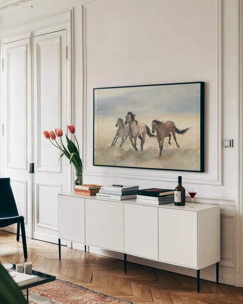 Wild Mustangs by Julia Purinton. shown as a framed stretched canvas in a living room above a console. Available as a archival giclee rolled canvas, fine art paper, or poster print. SKU 70759i.