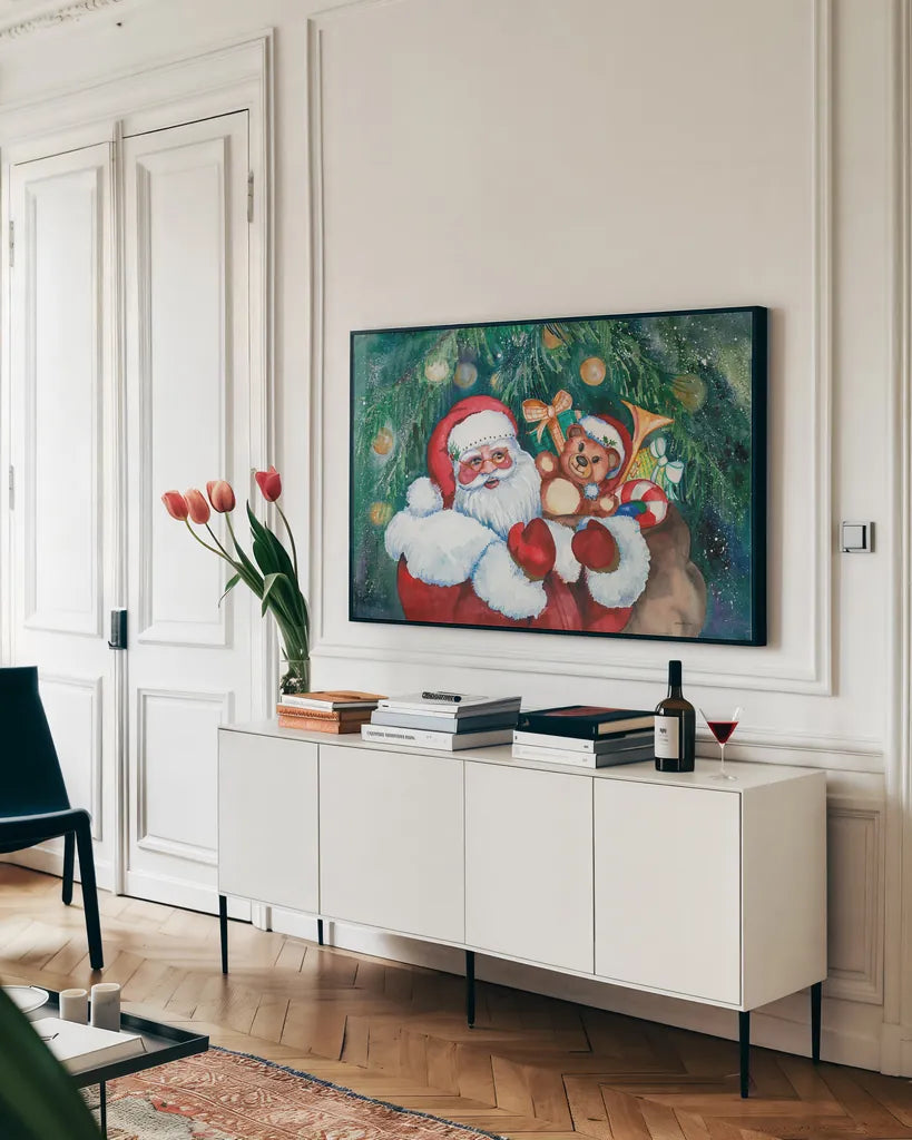 Jolly Santa by Kathleen Parr McKenna. shown as a framed stretched canvas in a living room above a console. Available as a archival giclee rolled canvas, fine art paper, or poster print. SKU 70545i.