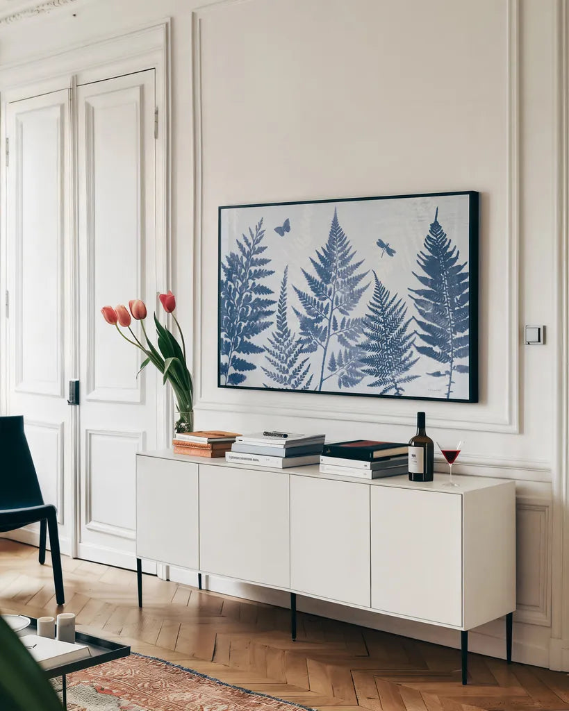 True Blue II by Katie Pertiet. shown as a framed stretched canvas in a living room above a console. Available as a archival giclee rolled canvas, fine art paper, or poster print. SKU 62862i.