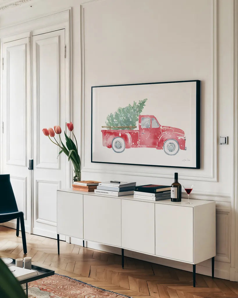 Christmas Truck by Katrina Pete. shown as a framed stretched canvas in a living room above a console. Available as a archival giclee rolled canvas, fine art paper, or poster print. SKU 67457i.