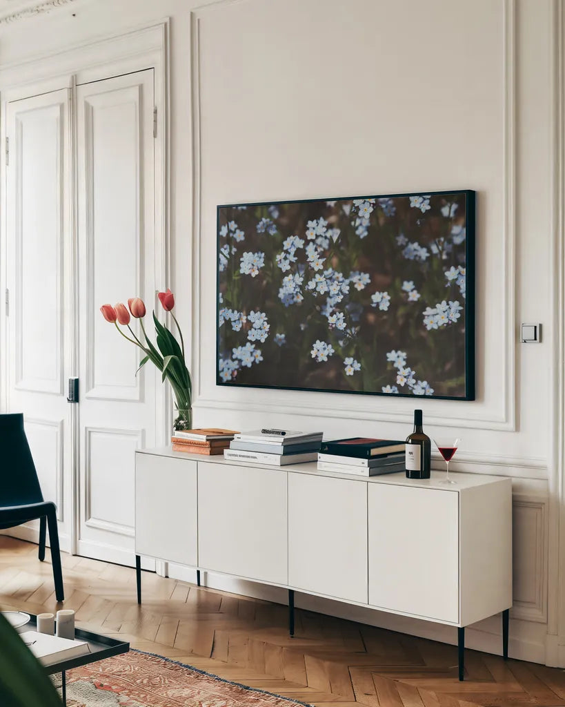 Forget Me Nots I by Laura Marshall. shown as a framed stretched canvas in a living room above a console. Available as a archival giclee rolled canvas, fine art paper, or poster print. SKU 63259i.