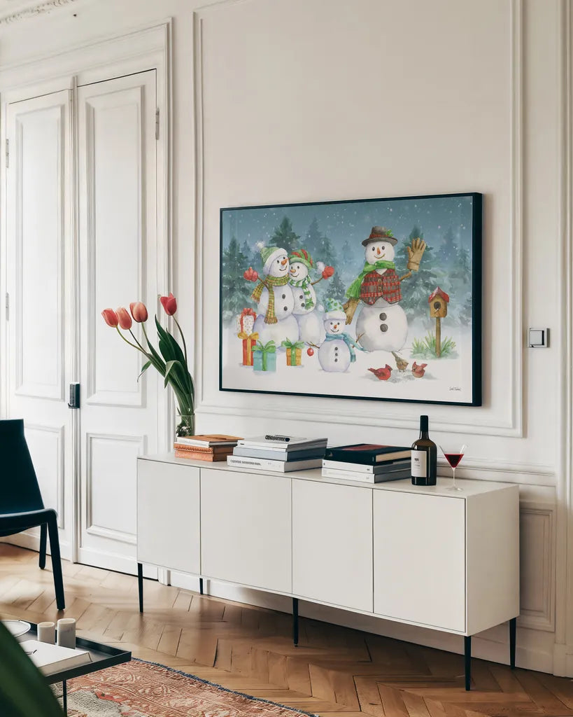 Snowman Family I by Leslie Trimbach. shown as a framed stretched canvas in a living room above a console. Available as a archival giclee rolled canvas, fine art paper, or poster print. SKU 85253i.