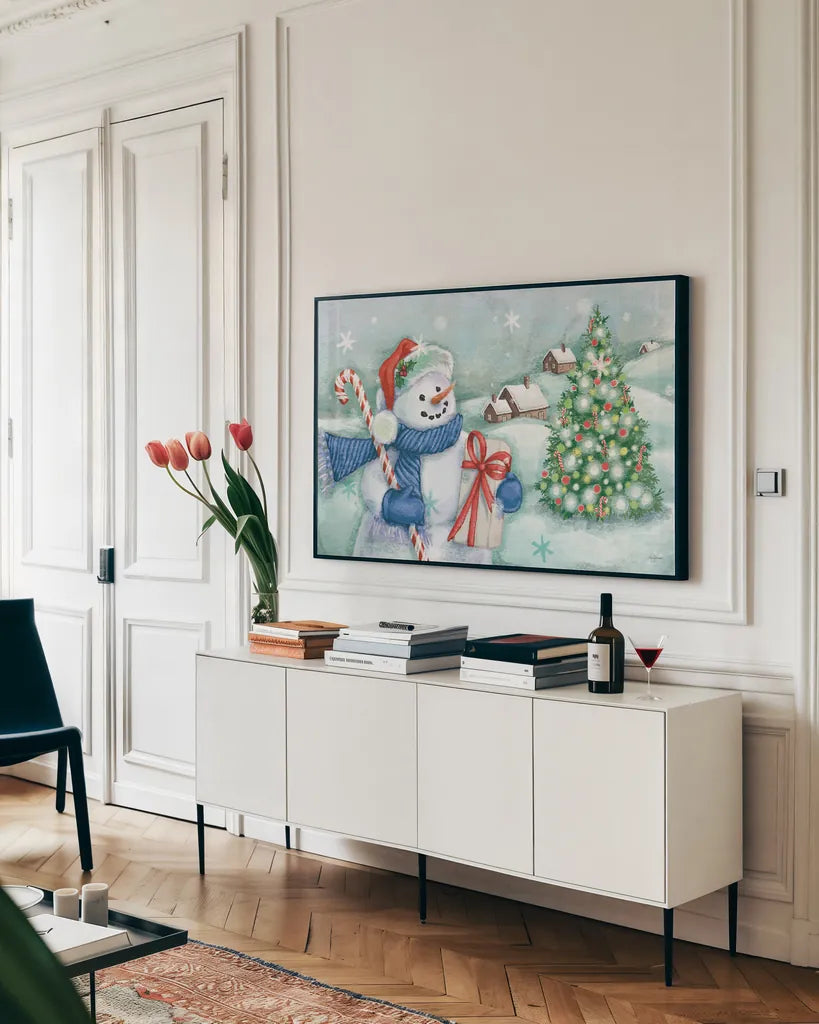 Classic Snowmen I Blue by Mary Urban. shown as a framed stretched canvas in a living room above a console. Available as a archival giclee rolled canvas, fine art paper, or poster print. SKU 57863i.