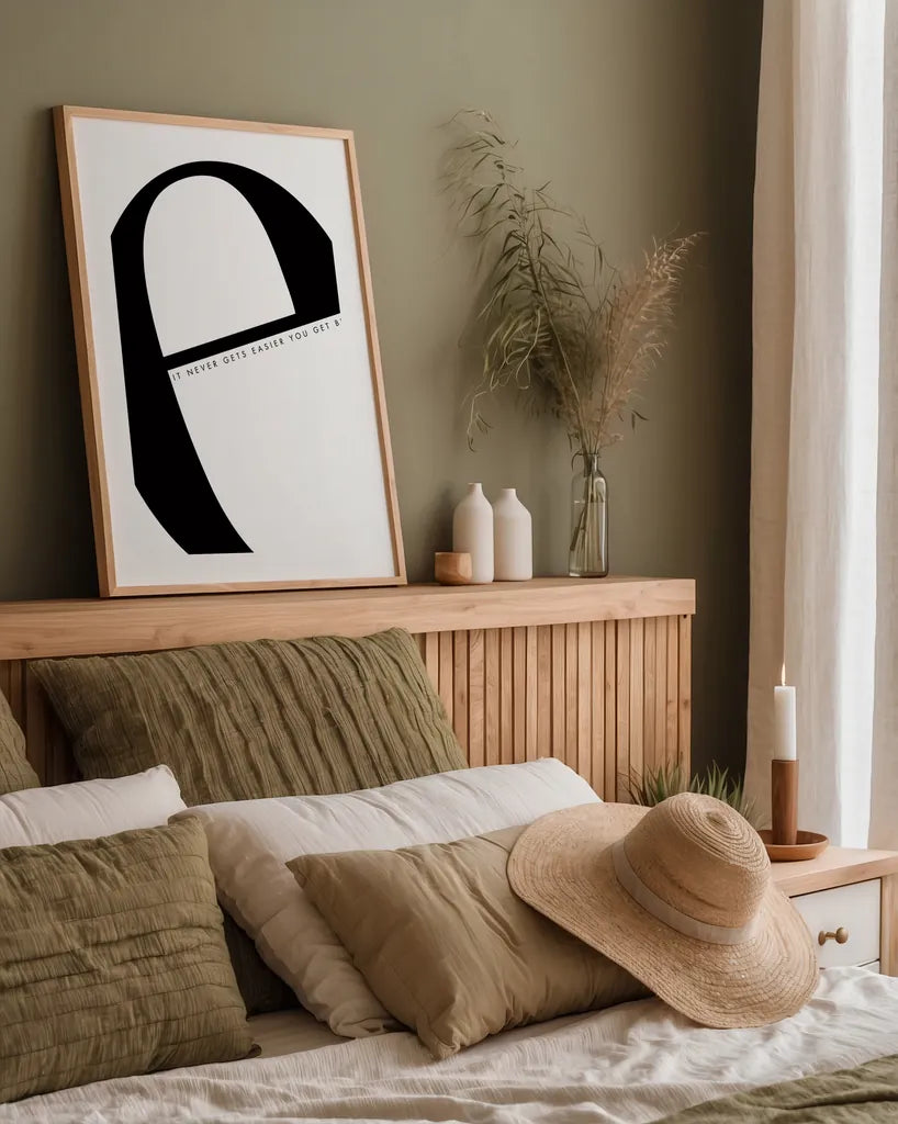 E is for Easier on White by Mercedes Lopez Charro. shown as a paper print in a natural frame. Available as a archival giclee rolled canvas, fine art paper, or poster print. SKU 64145h.