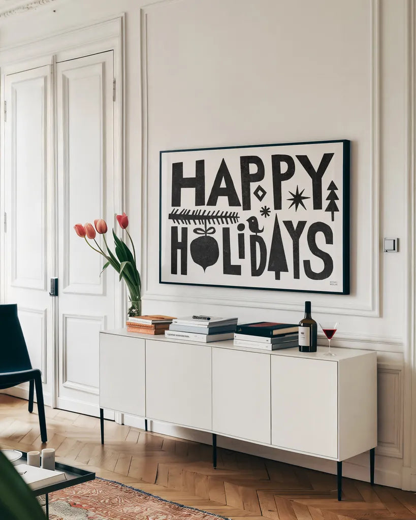 Christmas Whimsy Happy Holidays Black by Michael Mullan. shown as a framed stretched canvas in a living room above a console. Available as a archival giclee rolled canvas, fine art paper, or poster print. SKU 79981i.