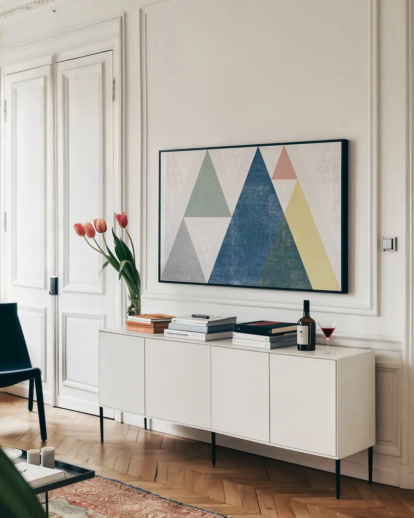 Mod Triangles I Soft by Michael Mullan. shown as a framed stretched canvas in a living room above a console. Available as a archival giclee rolled canvas, fine art paper, or poster print. SKU 33787i.
