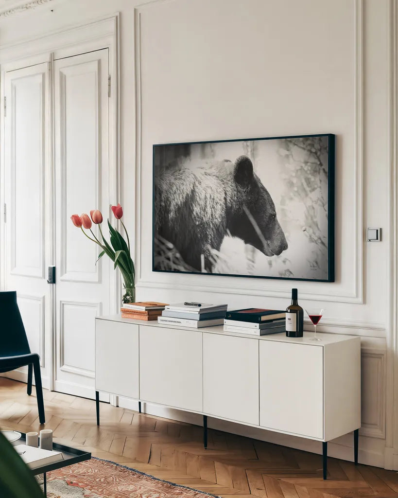 Bear Emerging by Nathan Larson. shown as a framed stretched canvas in a living room above a console. Available as a archival giclee rolled canvas, fine art paper, or poster print. SKU 80432i.