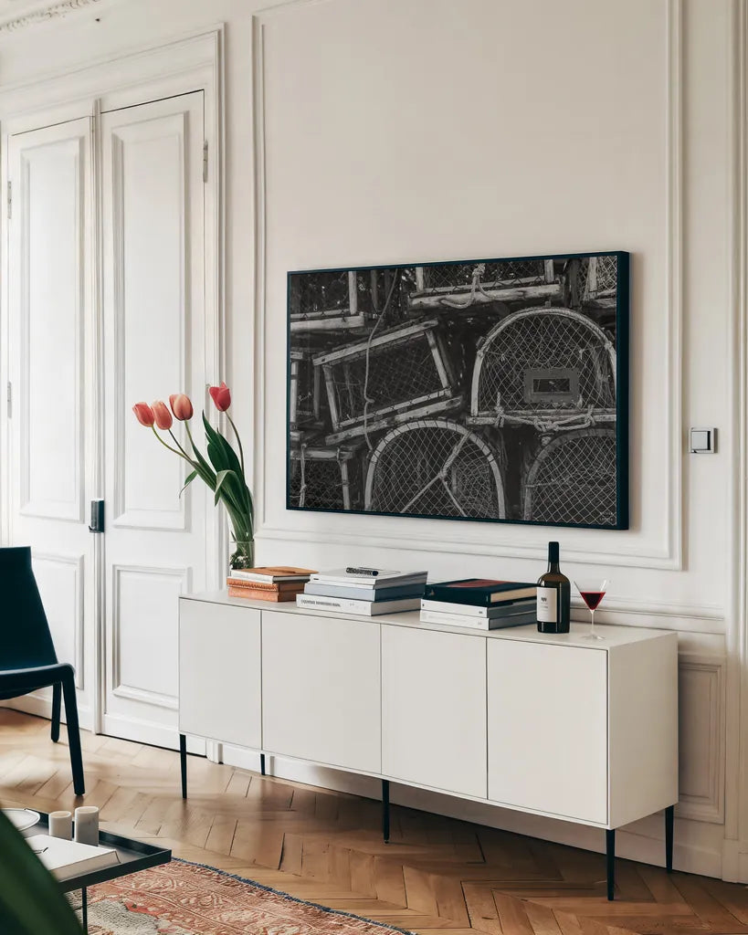 Fishing Village Traps by Nathan Larson. shown as a framed stretched canvas in a living room above a console. Available as a archival giclee rolled canvas, fine art paper, or poster print. SKU 102033i.