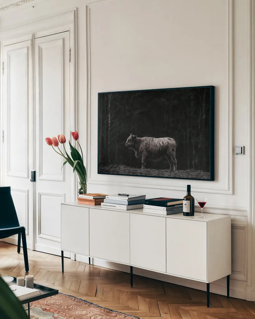 Hill Top Highland BW by Nathan Larson. shown as a framed stretched canvas in a living room above a console. Available as a archival giclee rolled canvas, fine art paper, or poster print. SKU 89479i.