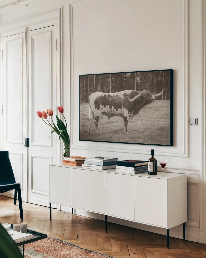 Longhorn Bull Sepia by Nathan Larson. shown as a framed stretched canvas in a living room above a console. Available as a archival giclee rolled canvas, fine art paper, or poster print. SKU 93355i.
