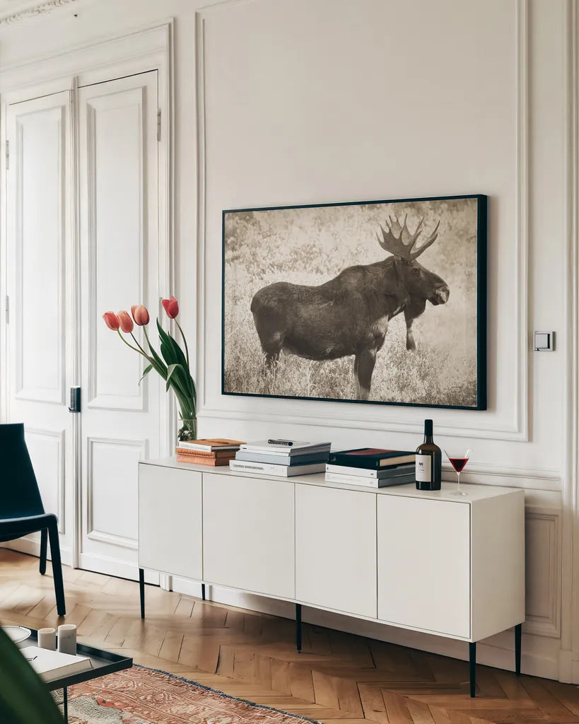 Medicine Bow Moose II by Nathan Larson. shown as a framed stretched canvas in a living room above a console. Available as a archival giclee rolled canvas, fine art paper, or poster print. SKU 89459i.