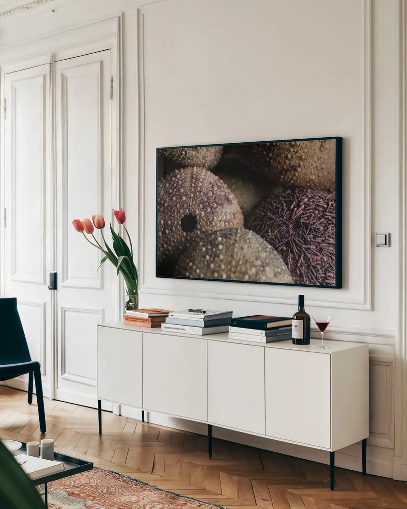 Purple Sea Urchins by Nathan Larson. shown as a framed stretched canvas in a living room above a console. Available as a archival giclee rolled canvas, fine art paper, or poster print. SKU 96957i.