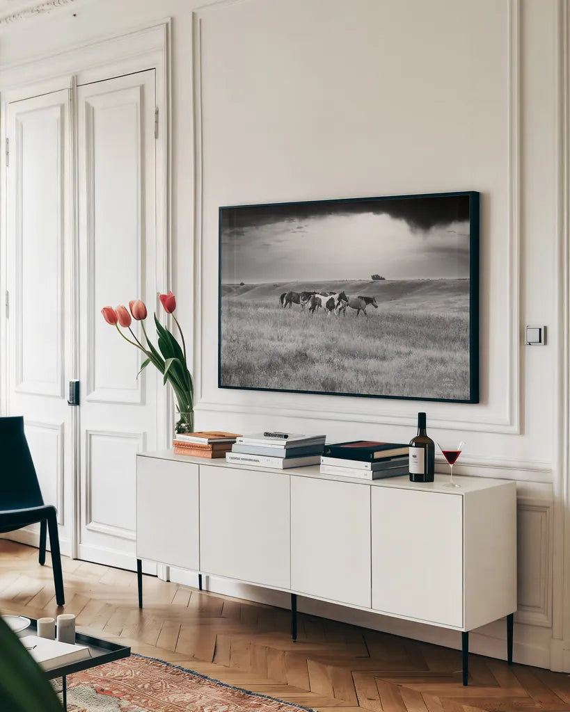 Sunset Rains by Nathan Larson. shown as a framed stretched canvas in a living room above a console. Available as a archival giclee rolled canvas, fine art paper, or poster print. SKU 82420i.