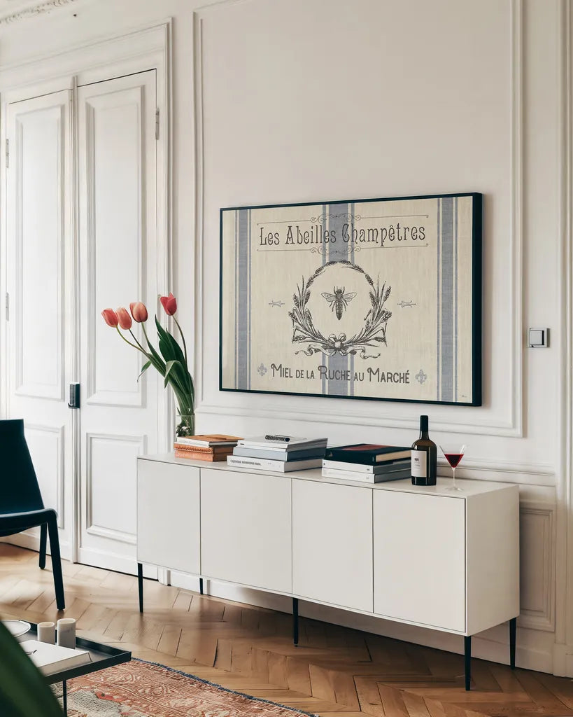 French Farmhouse I by Pela Studio. shown as a framed stretched canvas in a living room above a console. Available as a archival giclee rolled canvas, fine art paper, or poster print. SKU 45584i.