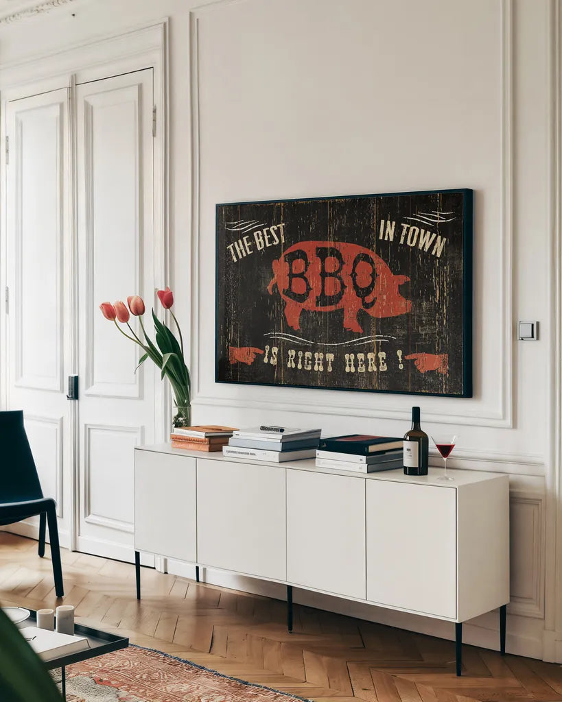 The Best BBQ in Town by Pela Studio. shown as a framed stretched canvas in a living room above a console. Available as a archival giclee rolled canvas, fine art paper, or poster print. SKU 11735i.