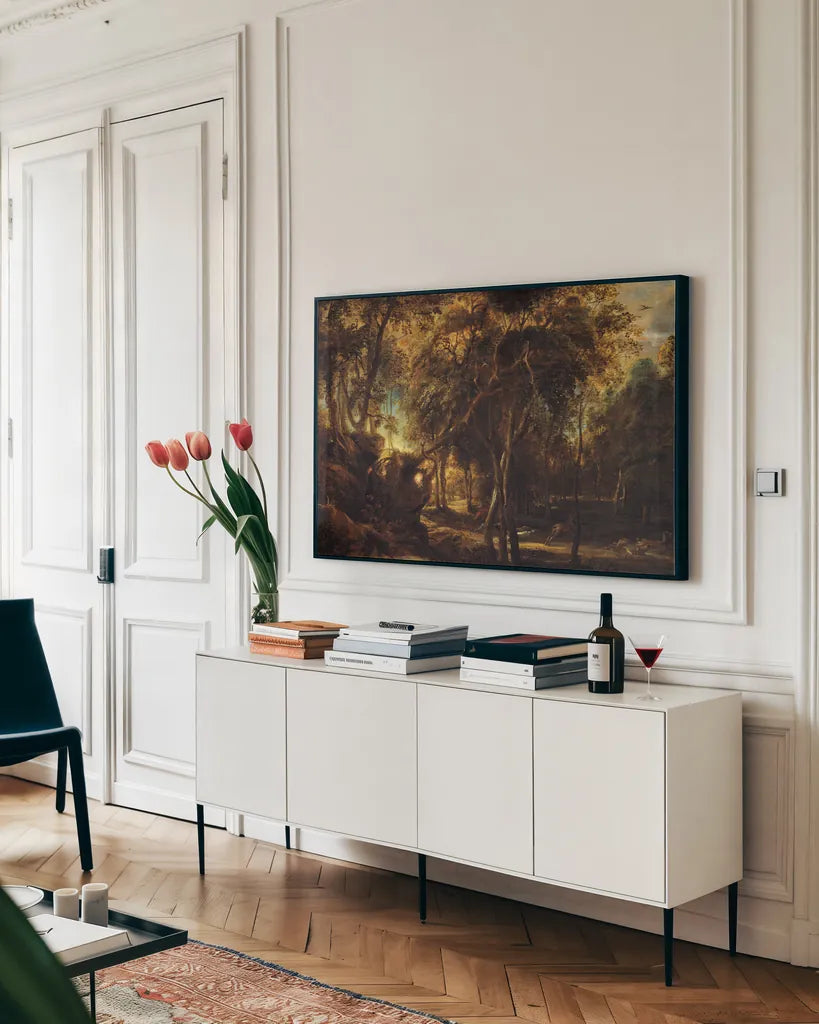 A Forest at Dawn with a Deer Hunt by Public Domain. shown as a framed stretched canvas in a living room above a console. Available as a archival giclee rolled canvas, fine art paper, or poster print. SKU 95528i.