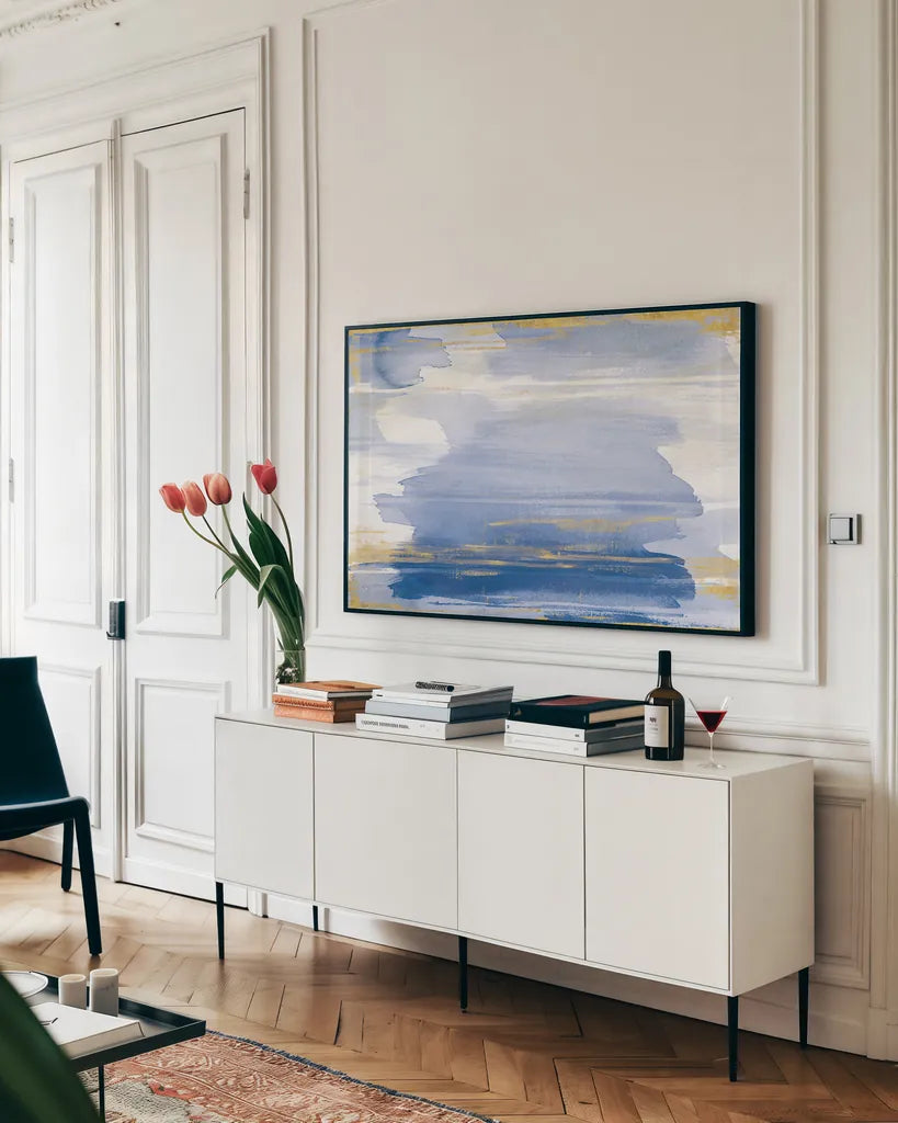 A Rosy View Blue by Sue Schlabach. shown as a framed stretched canvas in a living room above a console. Available as a archival giclee rolled canvas, fine art paper, or poster print. SKU 68141i.