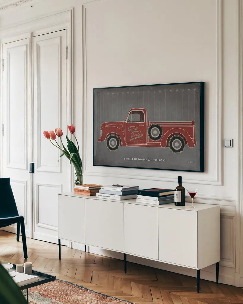 Farm Truck by Sue Schlabach. shown as a framed stretched canvas in a living room above a console. Available as a archival giclee rolled canvas, fine art paper, or poster print. SKU 51516i.
