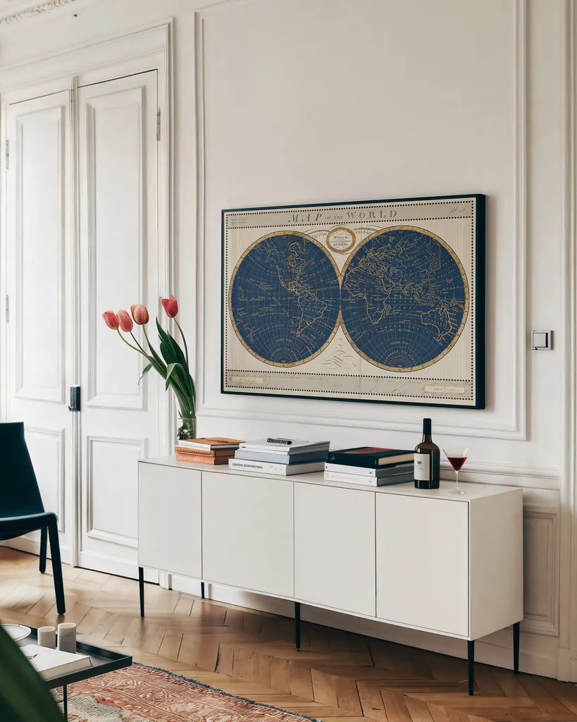Torkingtons World Map Indigo Globes by Sue Schlabach. shown as a framed stretched canvas in a living room above a console. Available as a archival giclee rolled canvas, fine art paper, or poster print. SKU 44846i.