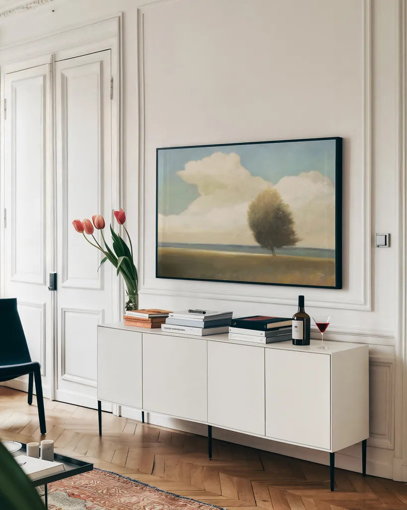 Windblown Tree by Wellington Studio. shown as a framed stretched canvas in a living room above a console. Available as a archival giclee rolled canvas, fine art paper, or poster print. SKU 89450i.