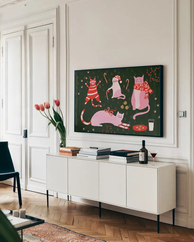 Mischief Kitty Christmas I by Yvette St. Amant. shown as a framed stretched canvas in a living room above a console. Available as a archival giclee rolled canvas, fine art paper, or poster print. SKU 97540i.
