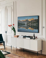 Alice Lake Sawtooh Mountains Idaho by Alan Majchrowicz. shown as a framed stretched canvas in a living room above a console. Available as a archival giclee rolled canvas, fine art paper, or poster print. SKU 81520i.