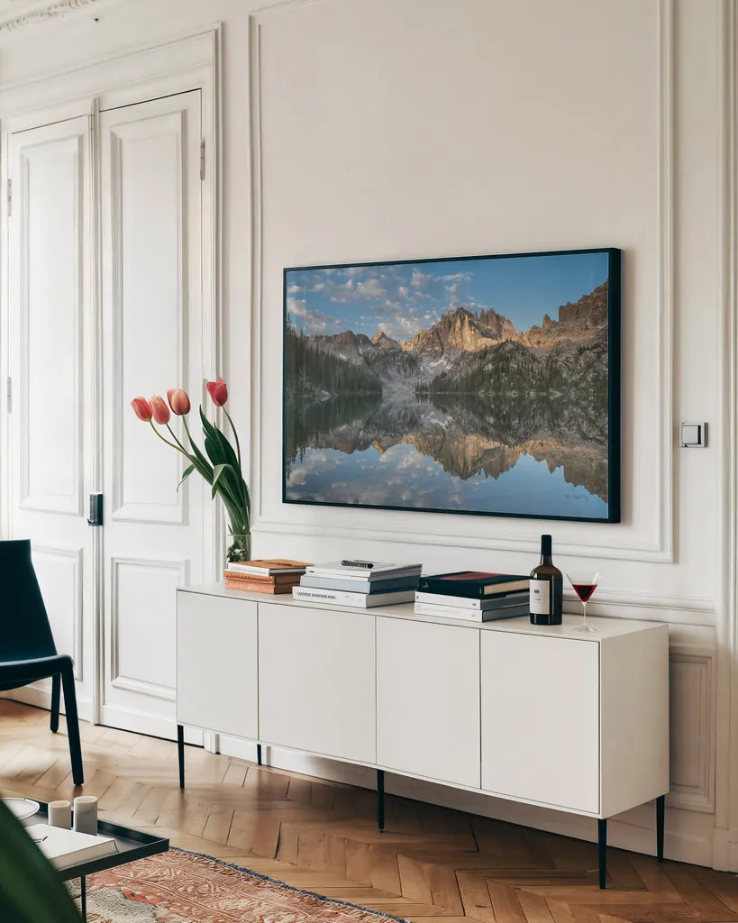 Baron Lake Monte Verita Peak Sawtooth Mountains II by Alan Majchrowicz. shown as a framed stretched canvas in a living room above a console. Available as a archival giclee rolled canvas, fine art paper, or poster print. SKU 81522i.