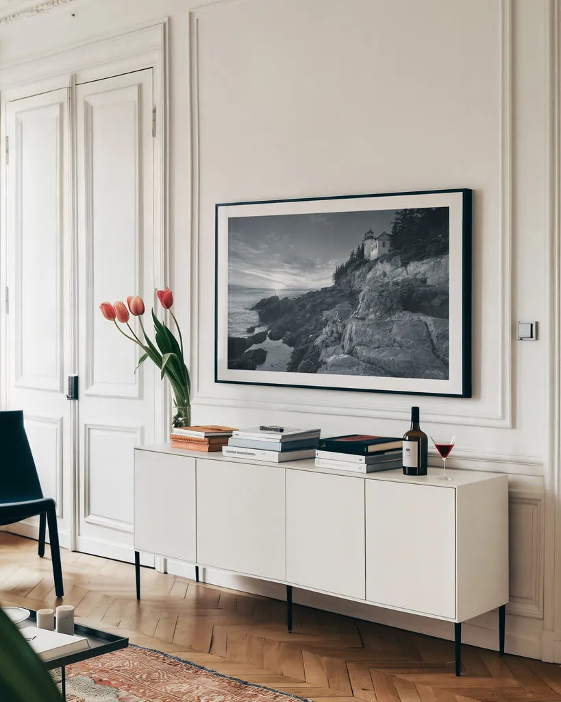 Bass Harbor Head Sunset by Alan Majchrowicz. shown as a framed stretched canvas in a living room above a console. Available as a archival giclee rolled canvas, fine art paper, or poster print. SKU 33906i.