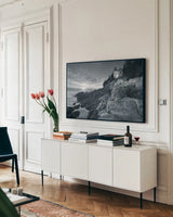 Bass Harbor Head Sunset no Border by Alan Majchrowicz. shown as a framed stretched canvas in a living room above a console. Available as a archival giclee rolled canvas, fine art paper, or poster print. SKU 34040i.