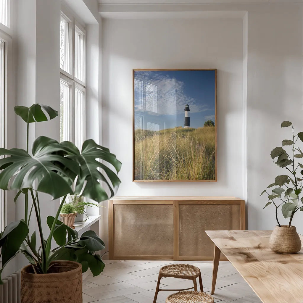 Big Sable Point Lighthouse I by Alan Majchrowicz. shown as a print in a natural wood frame in a dining room. Available as a archival giclee rolled canvas, fine art paper, or poster print. SKU 50032h.
