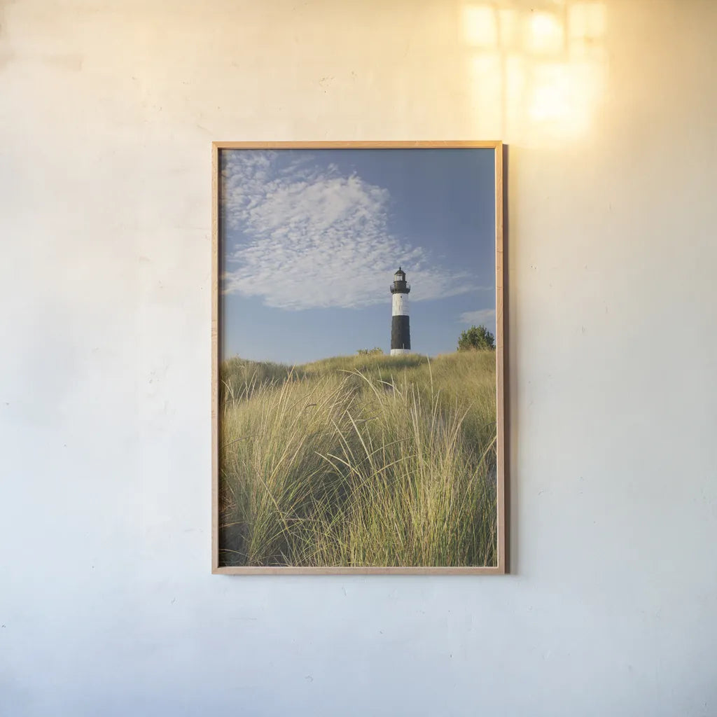 Big Sable Point Lighthouse I by Alan Majchrowicz. shown as a paper print in a natural frame. Available as a archival giclee rolled canvas, fine art paper, or poster print. SKU 50032h.