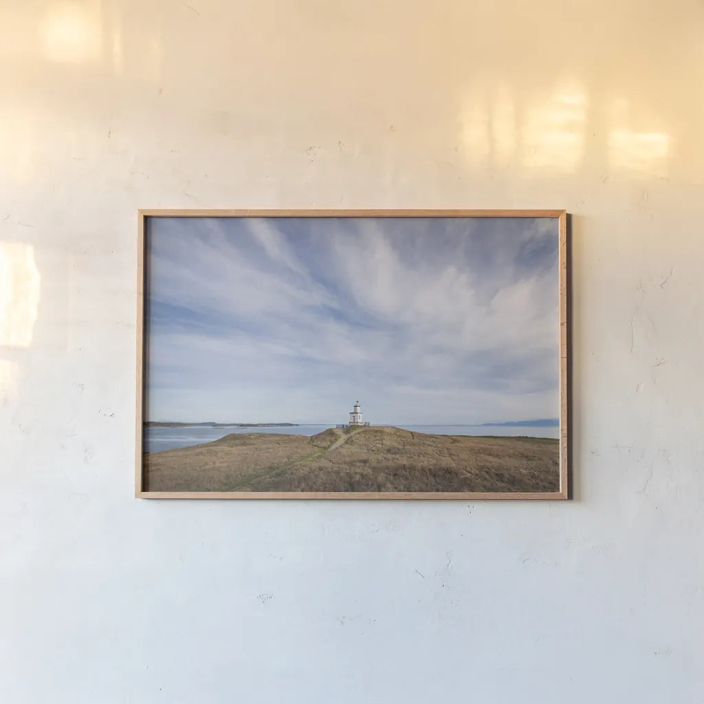 Cattle Point Lighthouse by Alan Majchrowicz. shown as a paper print in a natural frame. Available as a archival giclee rolled canvas, fine art paper, or poster print. SKU 86299i.