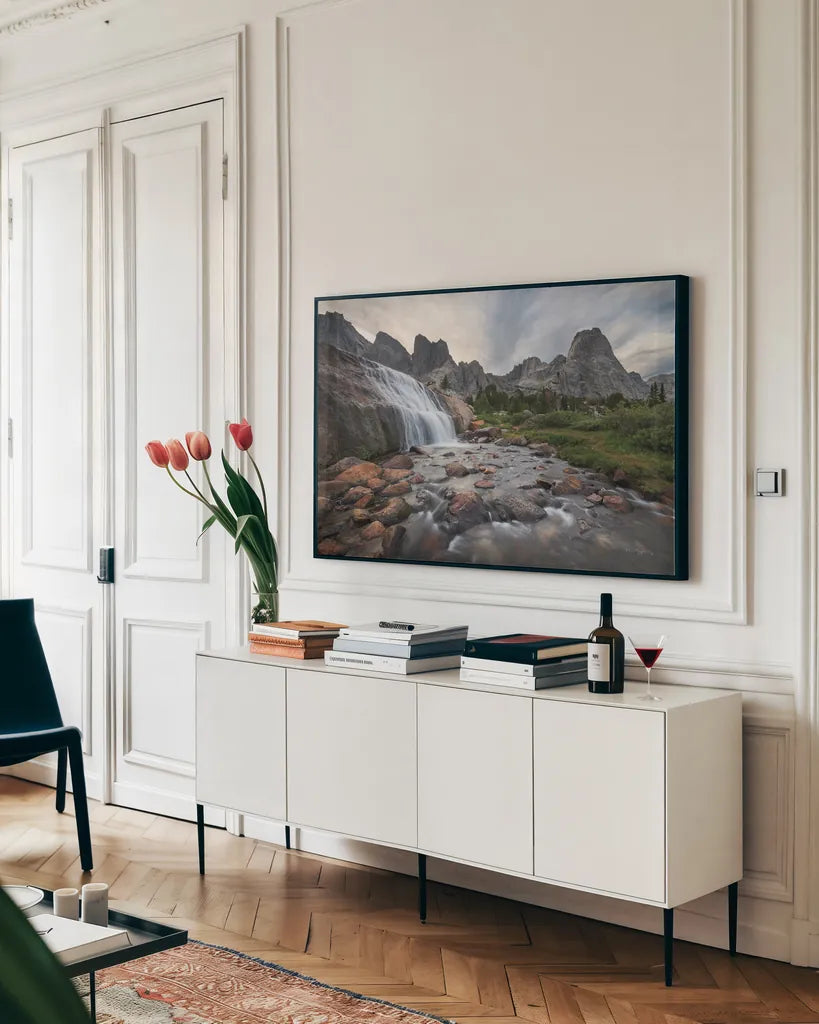 Cirque of the Towers Waterfall by Alan Majchrowicz. shown as a framed stretched canvas in a living room above a console. Available as a archival giclee rolled canvas, fine art paper, or poster print. SKU 84029i.